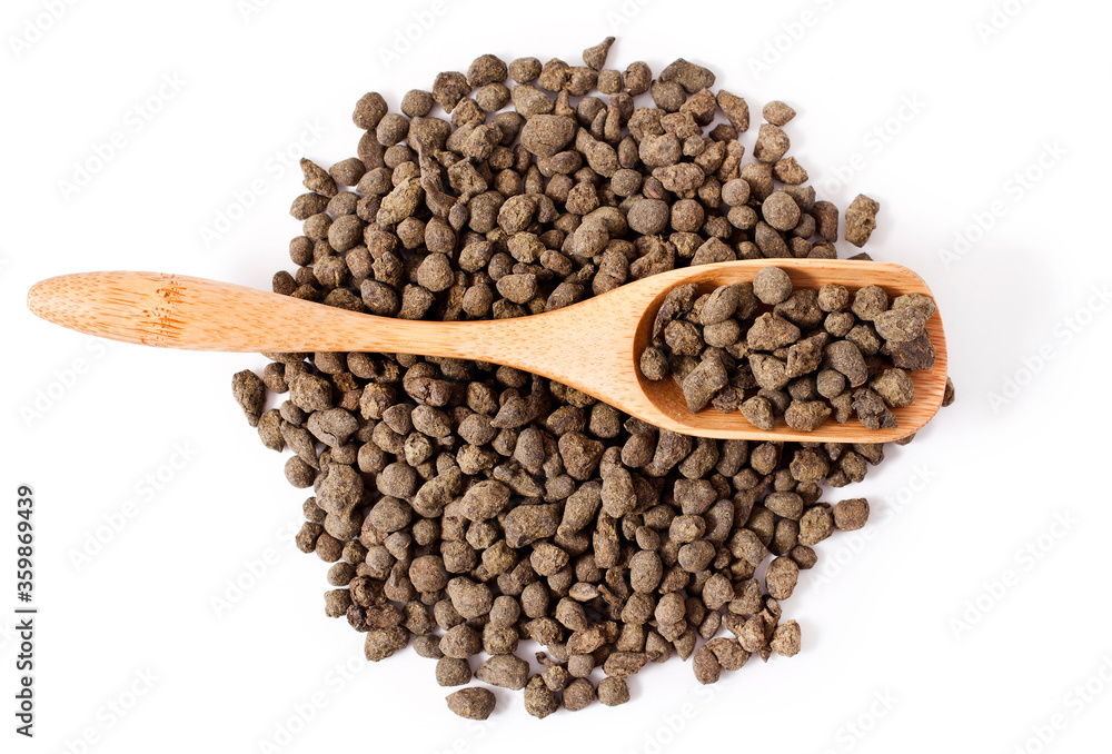 Ginseng oolong tea in a scoop isolated on a white background. Ginseng oolong tea in a scoop isolated on a white background.