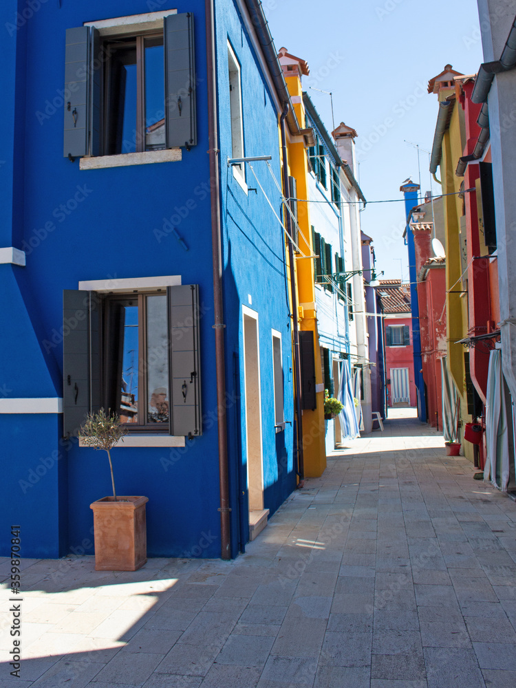 Narrow street with typical colored houses.
