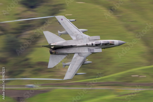 RAF (Royal Air Force) Panavia Tornado GR4 Fighter Bomber and reconnaissance jet flying low level in the UK, Cumbria, Wales and Scotland.   photo
