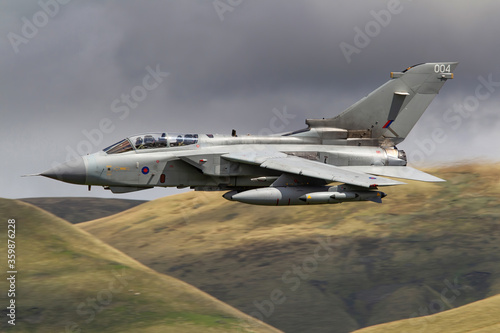 RAF (Royal Air Force) Panavia Tornado GR4 Fighter Bomber and reconnaissance jet flying low level in the UK, Cumbria, Wales and Scotland.   photo