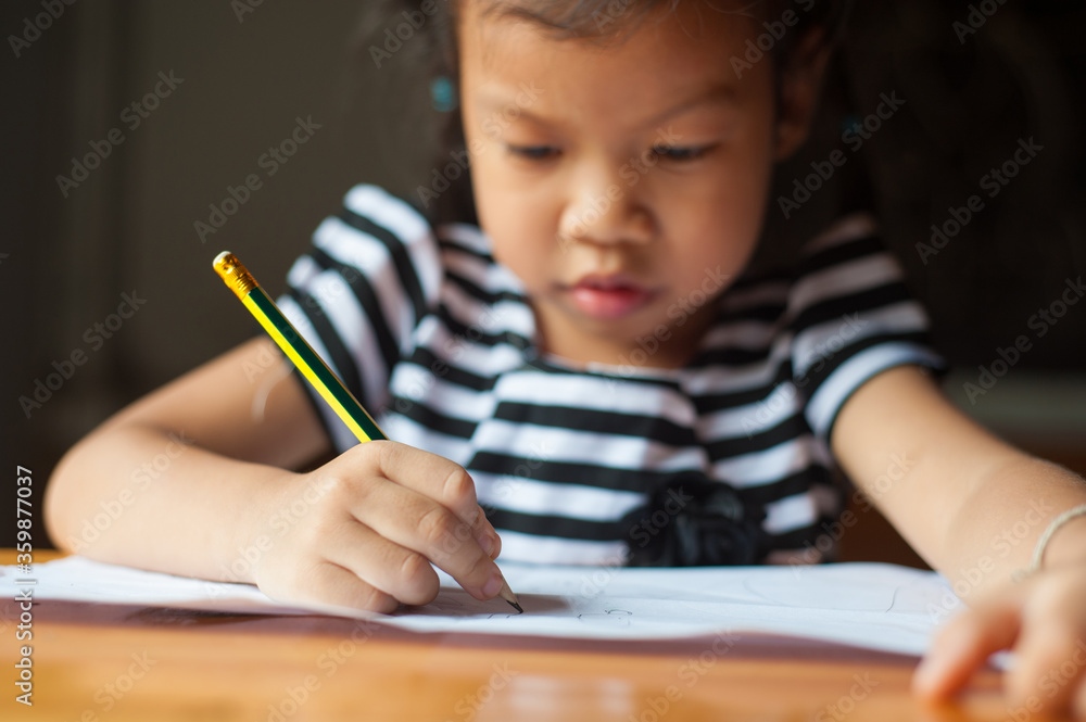 Children who are serious about writing books and doing homework. Children who are serious about writing books and doing homework.
