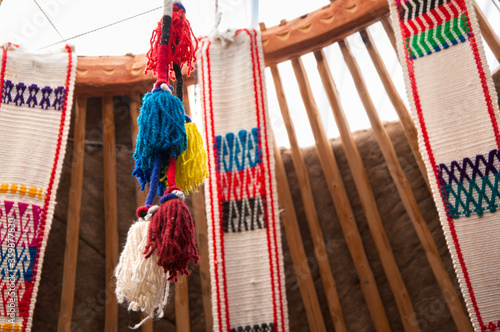 Traditional colorful textile ribbon decorations in nomadic house (yurt) in Central Asian countries (Kazakhstan, Kyrgyzstan) photo