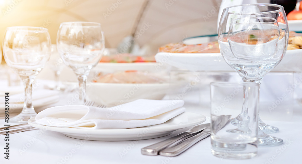 Beautiful festive table of luxury plates, glasses and cutlery served for wine tasting. Close up, blur background. Beautiful festive table of luxury plates, glasses and cutlery served for wine tasting. Close up, blur background.