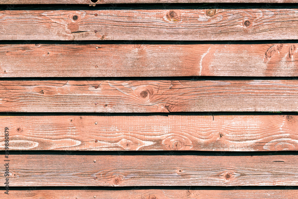 Natural background from old fading wooden boards. Space for lettering or design. Natural background from old fading wooden boards. Space for lettering or design.