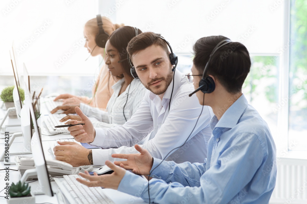 Customer support department team at work in call centre office Customer support department team at work in call centre office