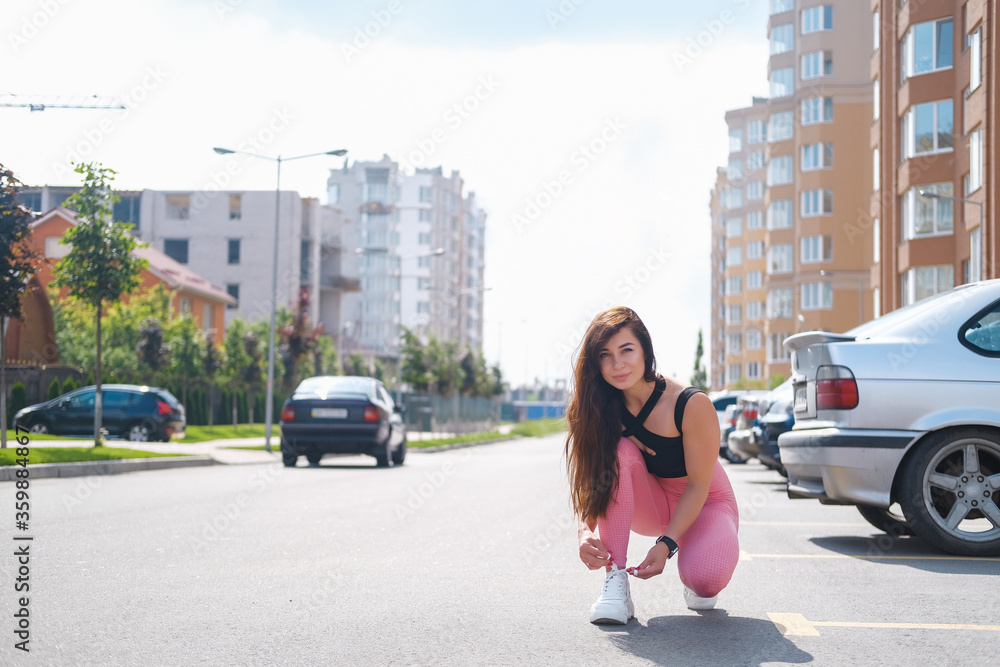 Girl running in the city. Fit and attractive woman has outdoor running workout. Girl running in the city. Fit and attractive woman has outdoor running workout.