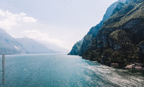 Bird's eye view of picturesque lake in Alps, nature basin with clean water at foot of majestic mountains. Scenic place in Natural Park of Sweden