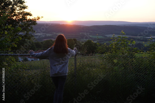 woman watching a romantic sundown 