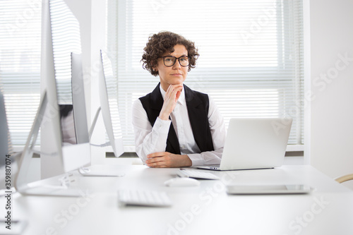 Portrait of a business woman at workplace in office
