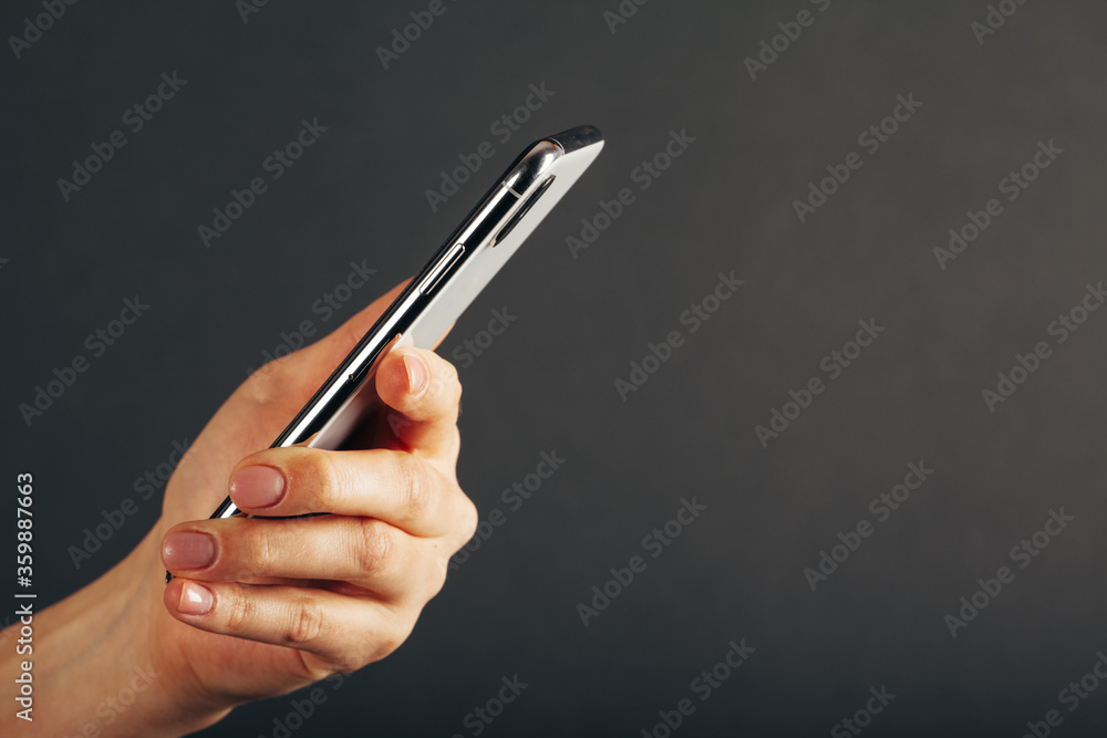 cellphone phone tablet in hand for advertisement on the grey backgrounds cellphone phone tablet in hand for advertisement on the grey backgrounds