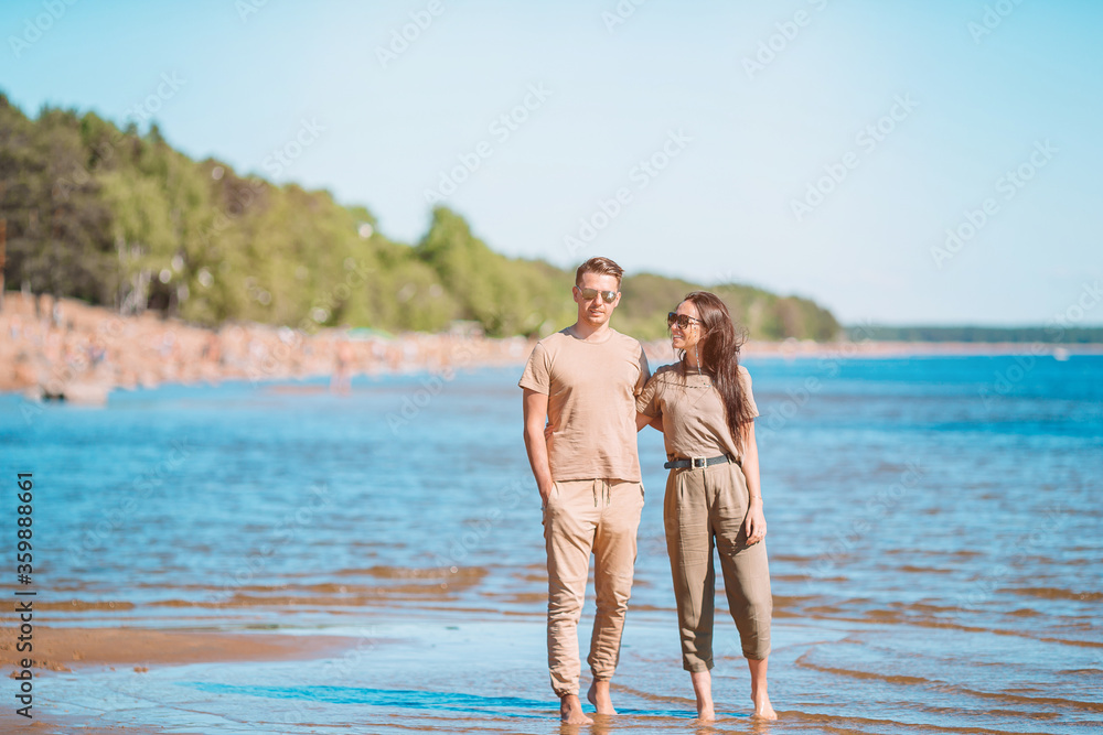 Young beautiful couple having fun on tropical seashore. Young beautiful couple having fun on tropical seashore.