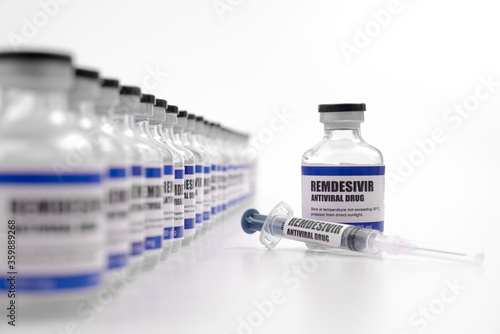 Remdesivir antiviral injectable drug vaccine medicine vial Covid-19 Corona Virus 2019-ncov syringe injection. Vaccination, immunization, treatment to cure Covid 19 Corona Virus disease Medical concept photo