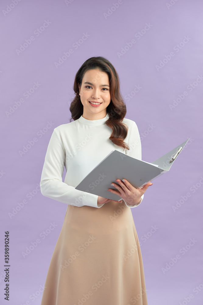Asian business woman holding open folder with document Asian business woman holding open folder with document