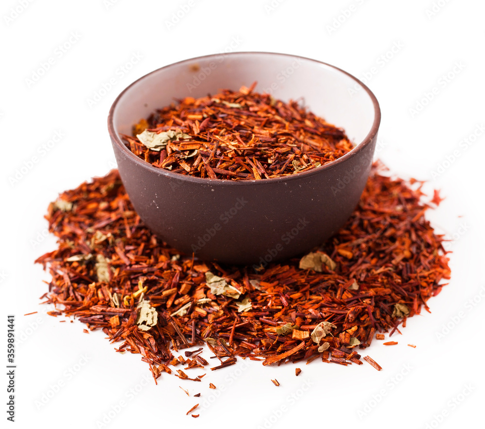 Rooibos tea in a ceramic bowl isolated on a white background. Rooibos tea in a ceramic bowl isolated on a white background.
