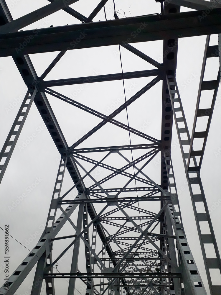 Metal construction of the railway bridge with the rising middle part for the passage of ships. Metal construction of the railway bridge with the rising middle part for the passage of ships.