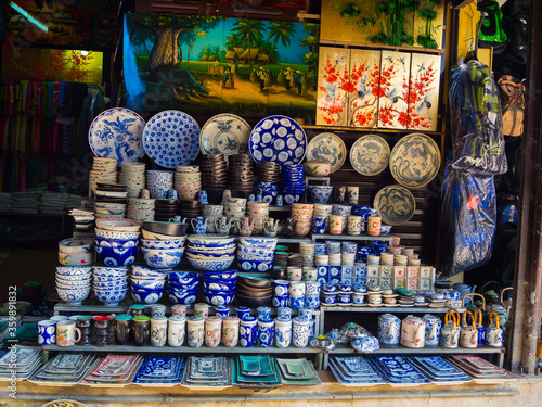 Obraz na płótnie Hoian, Vietnam - August 05, 2017: Common traditional pottery products on a shop in Bat Trang ancient ceramic village
