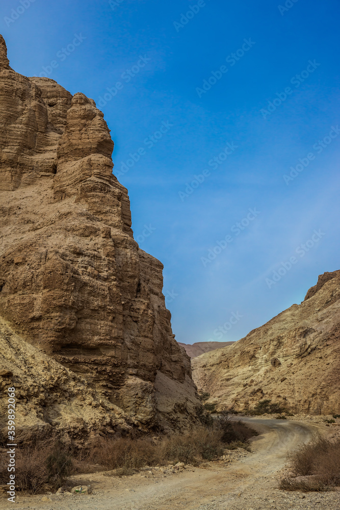 Fototapeta premium Dirt road through the canyon