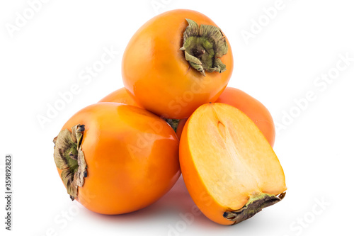 Fresh raw persimmon fruit isolated on white background, one cutted in half