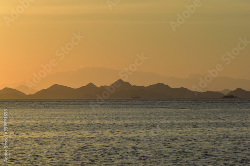 Sunset over the sea with mountains silhouette  Komodo Island  Labuan Bajo  East Nusa Tenggara  Indonesia