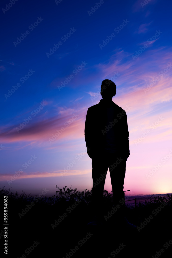 silhouette of a man standing against the sky