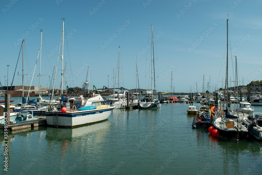 Newhaven Marina view of boats and yachts at moorings on a warm and sunny summers day on the the South Coast of England.