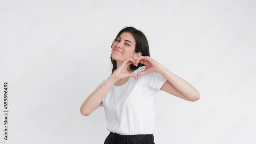 Supportive woman portrait. Compassion encouragement. Cheerful lady heart gesture air kiss isolated on white. Supportive woman portrait. Compassion encouragement. Cheerful lady heart gesture air kiss isolated on white.