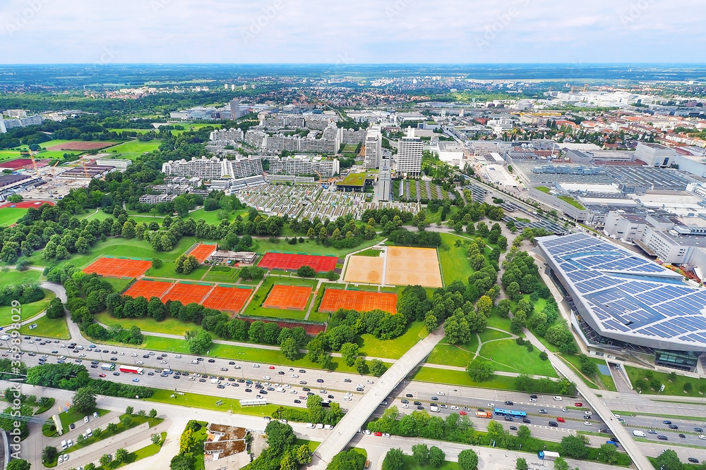 Aerial view of Munich City and park with sport tennis court from Olympiaturm (Olympic Tower) in Munich City Germany