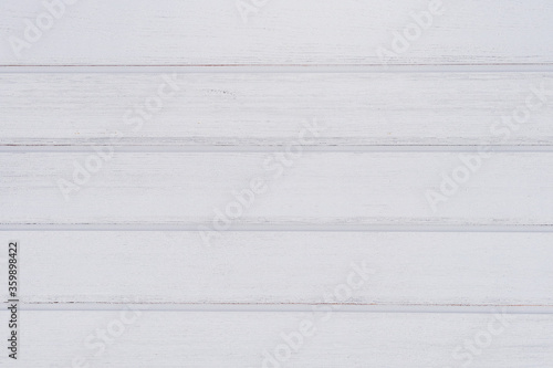 Vintage white wood plank background with copy space. Painted wall with horizontal wooden planks.