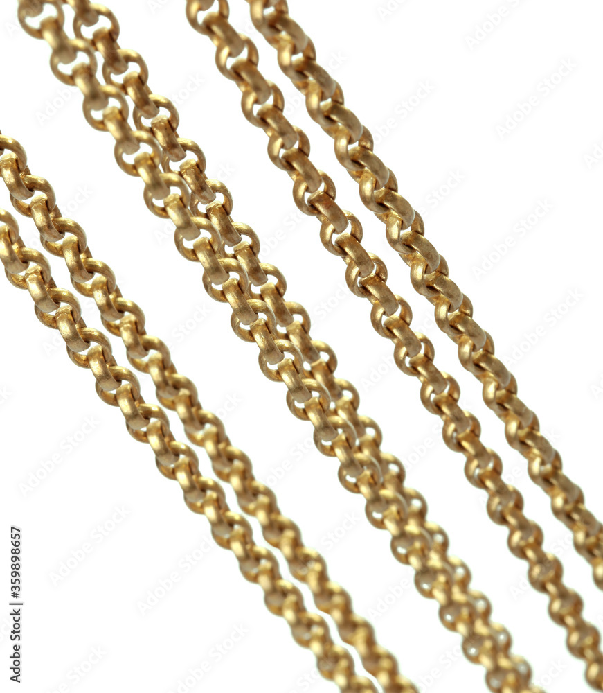 Fragment of a yellow metal chain on a white background. Isolated Fragment of a yellow metal chain on a white background. Isolated