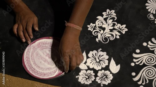 Rangoli stencil art demonstrated at a local market