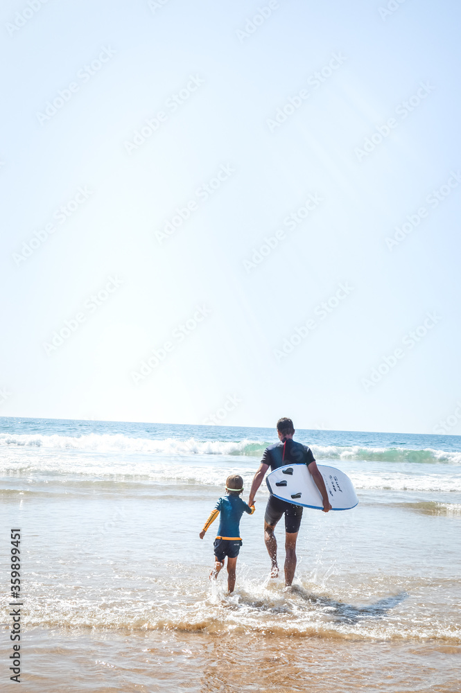 father and son surf