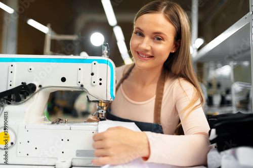 Portrait of seamstress working with sewing machine