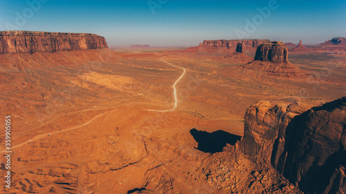 Bird s eye scenery view of unique geological formation of Arizona landmark. Monument Valley rocks one of the National symbols of the United States of America. Sandy desert landscape with roads