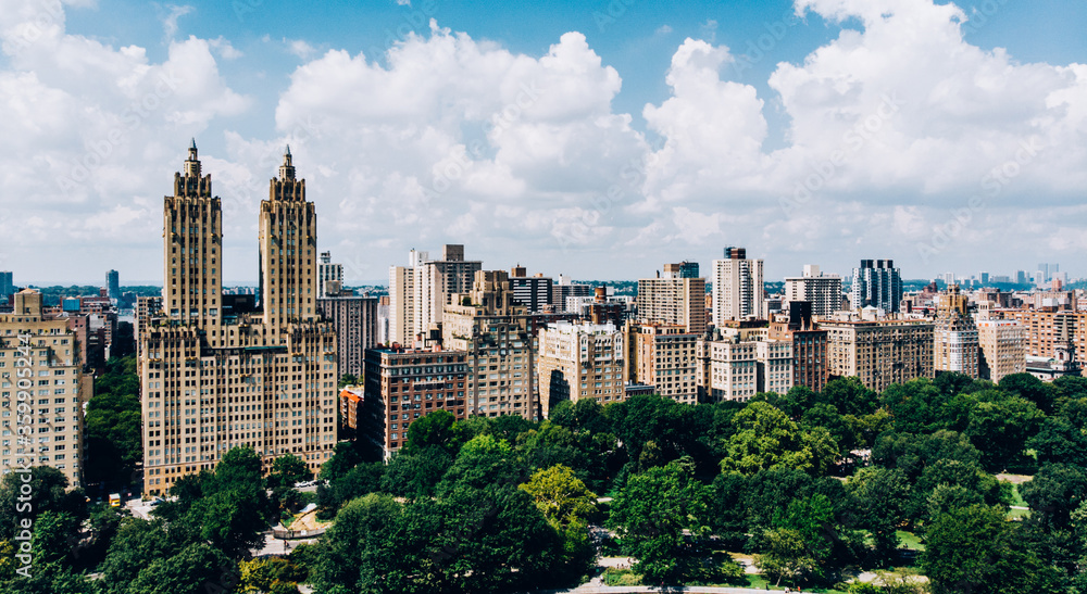 Aerial view from helicopter sightseeing tour around Central Park and Manhattan downtown. Scenery view of eco architecture in big New York megapolis. Preservation of nature and care of environment