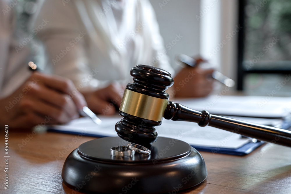 Husband and wife during divorce process and signing of divorce contract Husband and wife during divorce process and signing of divorce contract