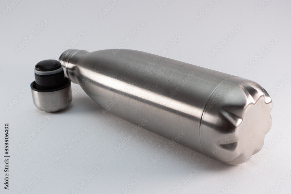 Metal flask, bottle for preservation of a hot or cold liquid on a white background. Metal flask, bottle for preservation of a hot or cold liquid on a white background.