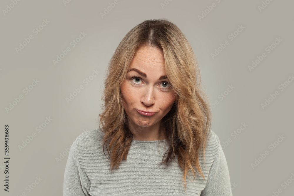 Cute woman grimacing on white background Cute woman grimacing on white background
