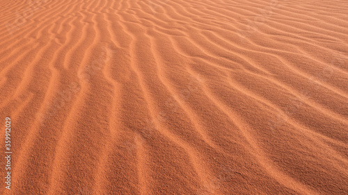 texture and background of a sand dune with traces of the wind in desert
