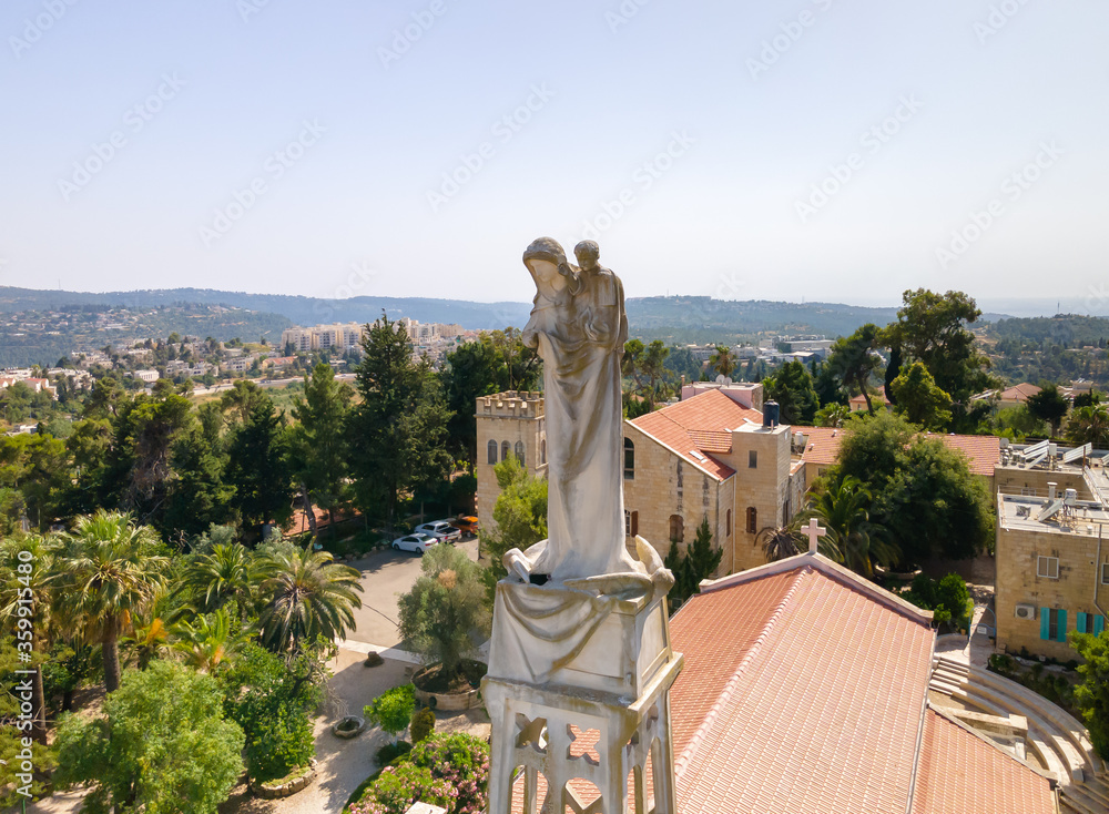 Statue of the Mother of God with a baby in her arms on the roof of the Our Lady of the Ark of the Covenant Church in the Chechen village Abu Ghosh near Jerusalem in Israel