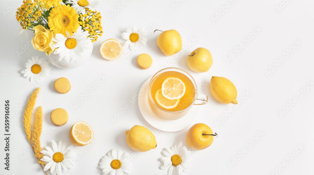 Spring and summer card. Daisies tea cup with lemon slice. Herbal tea with fresh flowers chamomile in mug. Vitamins, Healthy Diet. Concept of alternative medicine and immune boost. Cozy morning Spring and summer card. Daisies tea cup with lemon slice. Herbal tea with fresh flowers chamomile in mug. Vitamins, Healthy Diet. Concept of alternative medicine and immune boost. Cozy morning