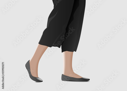 Legs of woman wearing black pants