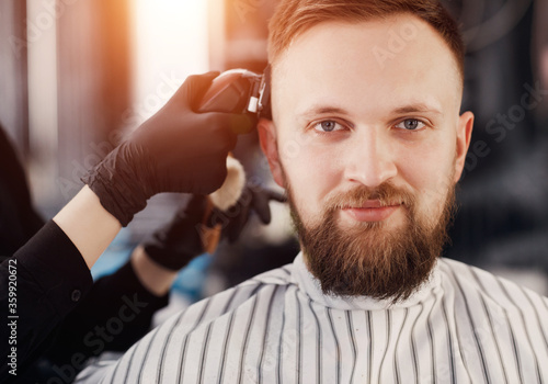 Close up face portrait in barbershop, man with beard 
