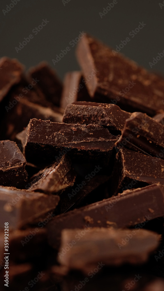 Chunks of sweet dark chocolate, close up, macro shot. Gourmet dessert ingredient Chunks of sweet dark chocolate, close up, macro shot. Gourmet dessert ingredient