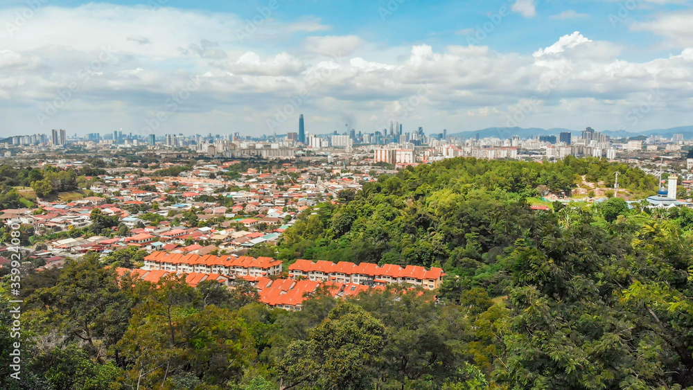 Panorama of all of Kuala Lumpur from the far outskirts of the city. Malaysia. Drone aerial footage.