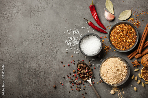 Various spices for cooking on stone background
