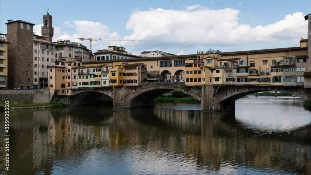 Time lapse of ponte vecchio in florence with blu sky and moving clouds Time lapse of ponte vecchio in florence with blu sky and moving clouds