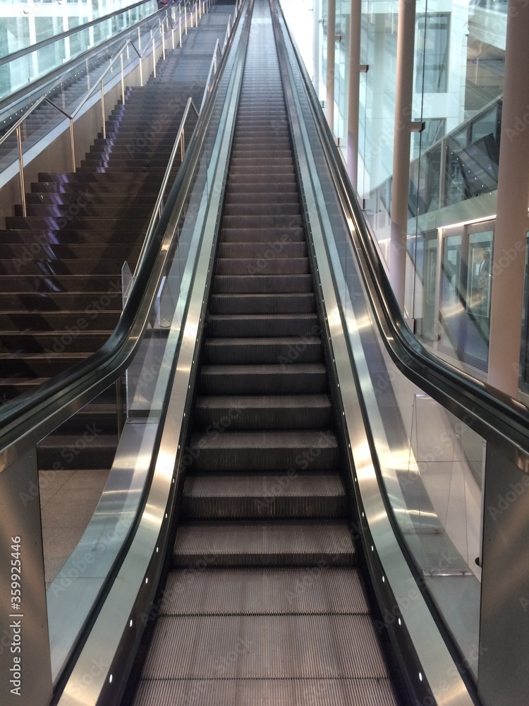 Long and empty escalator at Munich Airport Long and empty escalator at Munich Airport