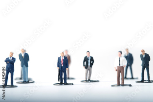 The new normal, people go to work maintaining physical distance in the crowd. Miniature people conceptual photography