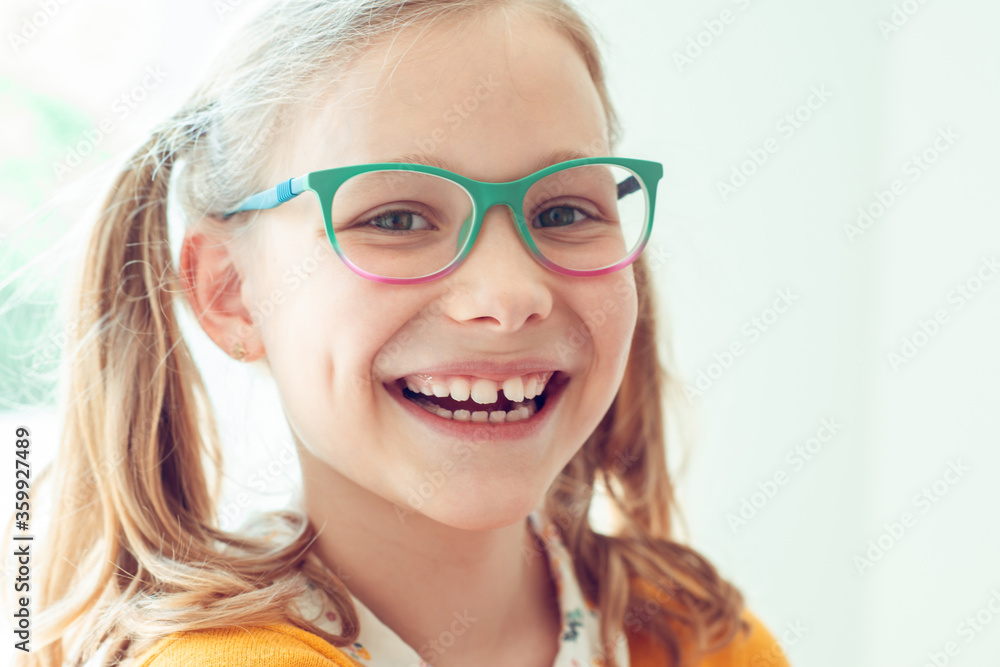 Portrait of happy pretty smiling teen girl in glasses Portrait of happy pretty smiling teen girl in glasses