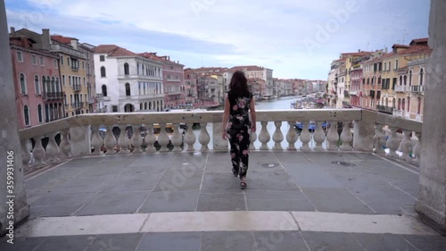 Wallpaper Mural Attractive young woman walk on the bridge of Rialto in Venice Italy looking at the Grand Canal Torontodigital.ca